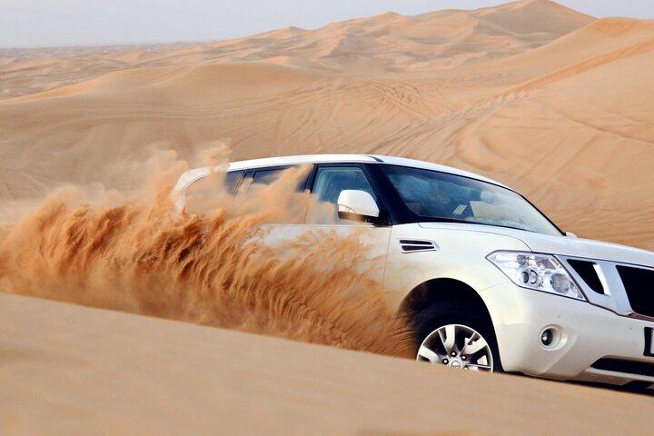 Safari dans le désert des dunes rouges de Dubaï : balade à dos de chameau, sandboard et barbecue