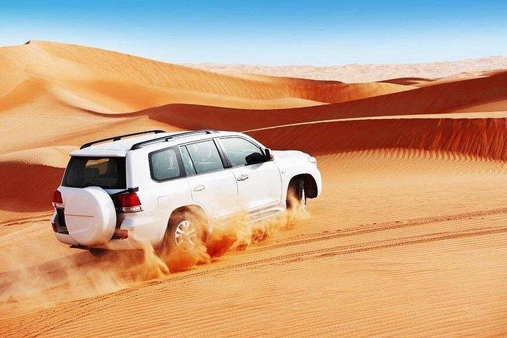 Promenade matinale dans les dunes avec sandboard et balade à dos de chameau